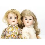 Two Armand Marseille bisque headed dolls, a 390n with blue sleeping eyes, replaced blonde wig,