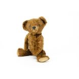 A brown mohair teddy bear 1930-40s, possibly French with clear and black glass eyes, clear and black
