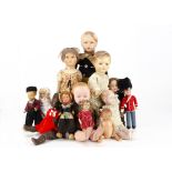 Various composition dolls, a Continental girl doll with moulded hair and original red printed