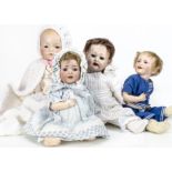 Four restored bisque headed character dolls, an SFBJ 235 with papier-mâchébody with bent arms and