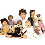 A quantity of various dolls, including a small French boudoir doll in traditional regional