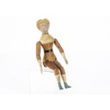A late 19th century Springfield (USA) carved wooden doll, with moulded head with blonde hair, turned