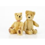 A small Schuco 1950s yes/no teddy bear, with golden mohair, clear and black glass eyes with brown