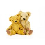 Two post-war Merrythought teddy bears, both with golden mohair, orange and black glass eyes, black