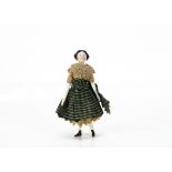 A late 19th century china shoulder-head dolls' house doll, with black moulded hair, rosy cheeks,