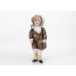A Schoenau & Hoffmeister 914 child doll, with brown sleeping eyes, nylon blonde wig, jointed