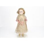 A Cuno & Otto Dressel shoulder-head doll, with fixed brown glass eyes, blonde mohair wig, head
