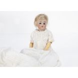 A Simon & Halbig for Kämmer & Reinhardt child doll, with blue sleeping eyes, blonde mohair wig,
