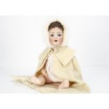 An Alt, Beck & Gottschalk 1361 character baby, with blue sleeping eyes, brown mohair wig, bent-