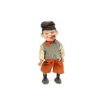 A papier-mâché headed clockwork walk Dutch man 1930s, with brown painted side glancing eyes, smoking