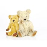 A post-war Chiltern Hugmee teddy bear, with white wool/mix plush, clear and black glass eyes,