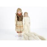 Two German composition dolls, a small shoulder head doll with blue sleeping eyes, blonde mohair wig,