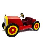 An unusual 'rocking horse' motor car, of recent manufacture, red painted wood with yellow trim and
