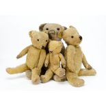 Four worn British 1930s teddy bears, two Merrythought with foot labels and metal part of button; a