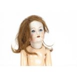 A Simon & Halbig for Kämmer & Reinhardt child doll with flapper body, blue lashed sleeping eyes,