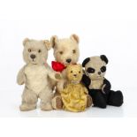 Four post-war Chiltern teddy bears, a standing musical Bruin with beige mohair, orange and black