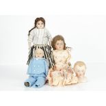 Four British bisque dolls, an Empire shoulder head character with blue painted eyes, open/closed