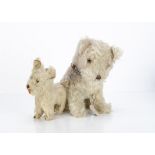 Two mohair toy dogs, a British 1930s dog with light brown and white mohair, clear and black glass