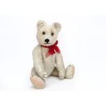 A Jopi white mohair teddy bear 1930s, with clear and black glass eyes with brown painted backs,