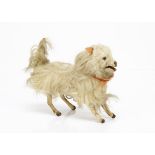 A clockwork leaping Spitz dog probably Roullet & Decamps, with long white fur, clear and black glass