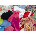 A large quantity of doll's clothes, including fashion dolls clothes and for large dolls, some Barbie