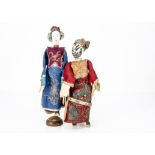 Two Chinese Opera dolls, comprising a Jing male doll with black and white painted face and a Dan