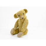 'Terrence' a Terrys-type teddy bear circa 1920, with golden mohair, clear and black oily glass eyes,