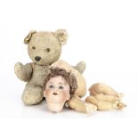 A Schuttzmeister & Quendt 201 character baby, with brown lashed sleeping eyes, brown mohair wig