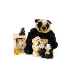 A small Micha Bears teddy bear cuddling two puppies, a small The Bear Basket panda --4 ½in. (11.