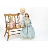 An Armand Marseille 390 child doll, with blue lashed sleeping eyes, blonde wig, jointed walking