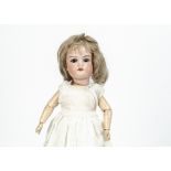 An Armand Marseille 390 child doll, with brown sleeping eyes, blonde mohair wig, jointed composition