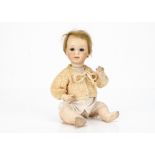 A Gebruder Heubach 8017 character baby, with blue sleeping eyes, closed mouth, blonde mohair wig,