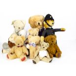 Nine post-war British teddy bears, a Merrythought policeman --18 ½in. (47cm.) high; two late Alpha