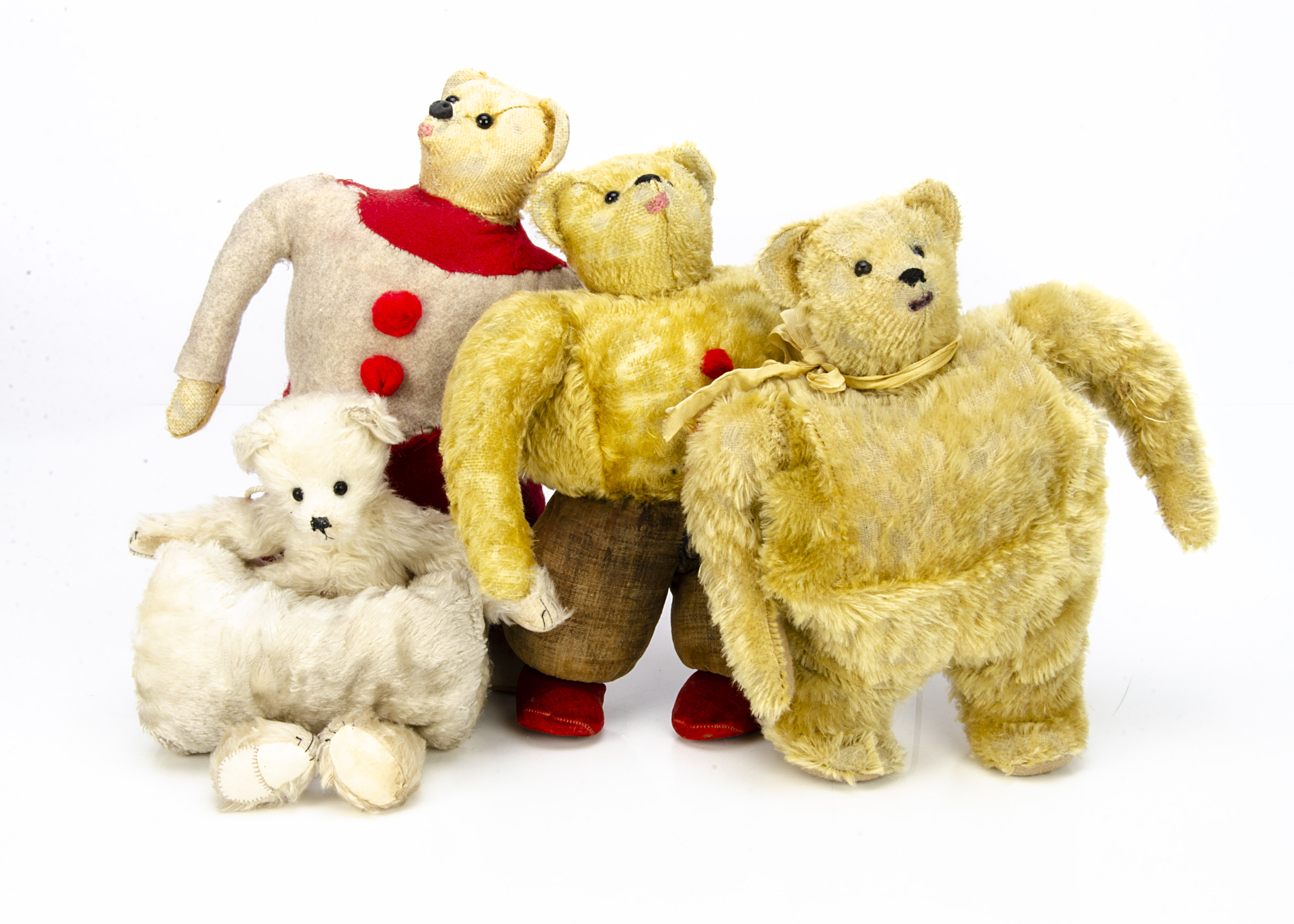 Four unusual teddy bears, a replica of a Strunz muff teddy bear --13in. (33cm.) high; two other