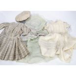 Four large doll's dresses, a cotton broderie Anglaise drop-waisted dress with puffed sleeves --20in.