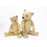 Two 1930s Chiltern-type teddy bears, both with swivel heads and jointed limbs, the larger with