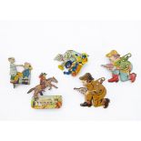 Five lithographed tinplate clicker toys, a cowboy riding a rearing horse --4in. (10cm.) high; a