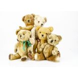 Five post-war teddy bears, a late white mohair Alpha Farnell with orange and black plastic eyes,