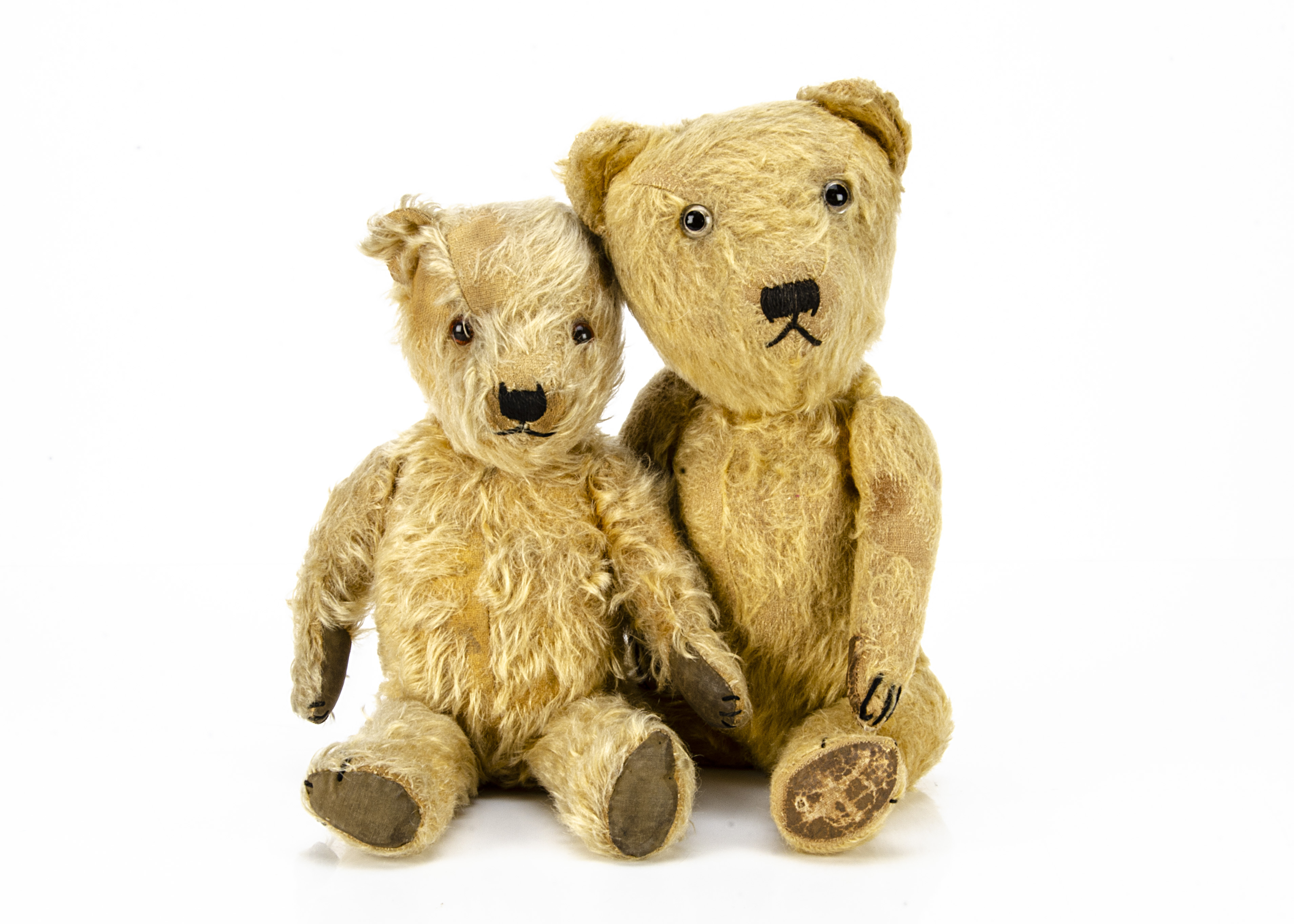 Two post-war British teddy bears, both with golden mohair, swivel heads and jointed limbs, the