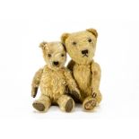 Two post-war British teddy bears, both with golden mohair, swivel heads and jointed limbs, the
