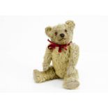 'Fabian' a 1920s British teddy bear, with blonde mohair, orange and black glass eyes, pronounced