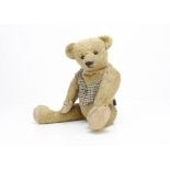 'Humpy' an early American teddy bear circa 1910, with golden mohair, black boot button eyes,