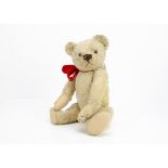Alexander' a British teddy bear 1930s, with light golden mohair, clear and black glass eyes with
