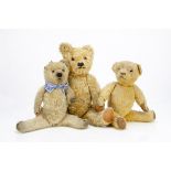 Three British teddy bears. a Jason Toys teddy bear with golden mohair, orange and black glass