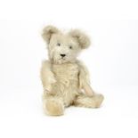 A German long brown-tipped white mohair teddy bear, with clear and black glass eyes, pronounced