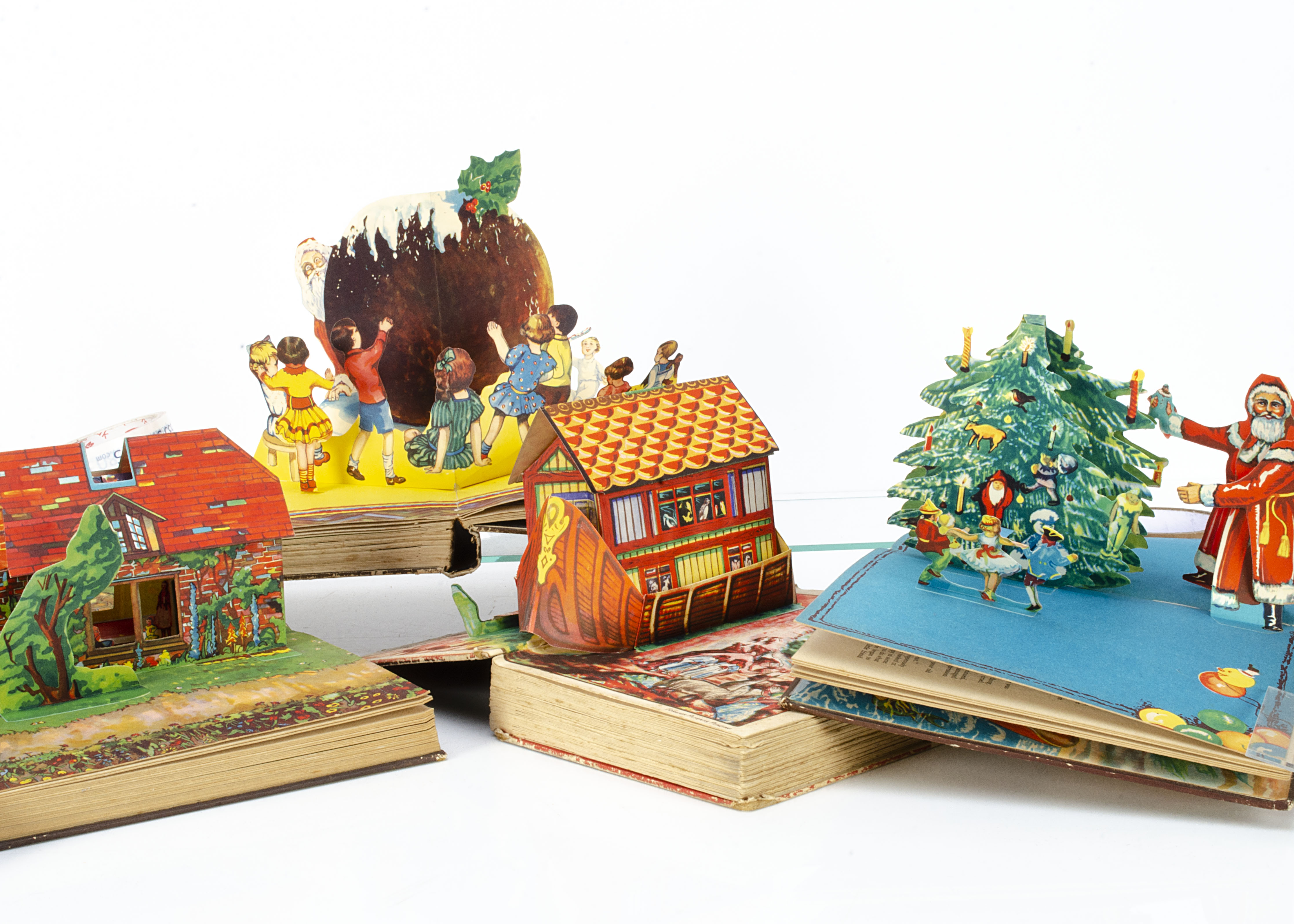 Three Bookano Stories pop-up books, two the same with coach and horses on cover (one worn) and the