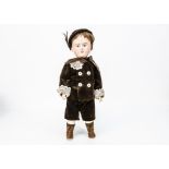 A Tout en Bois child doll, carved wooden doll with fixed blue glass eyes, closed mouth, brown hair