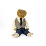 A German teddy bear 1920s, with short golden mohair, replaced button eyes, pronounced muzzle,