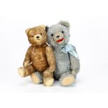 Two post-war Hermann-type teddy bears, a blue mohair example with orange and black glass eyes, inset