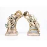 A pair of painted Parian sculptures of sleeping children by R J Morris, each reclining on a gender